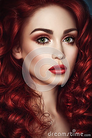 Beautiful redhead woman with wavy hair Stock Photo