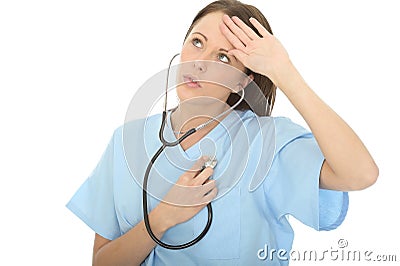 Beautiful Relieved Concerned Young Female Doctor Listening To Her Own Heartbeat Through Stethoscope Stock Photo