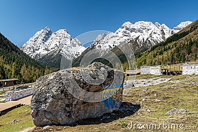 The beautiful religion stone and snow mountains in Four Girls Mountain scenic spot in Aba prefecture of Sichuan province, China. Editorial Stock Photo