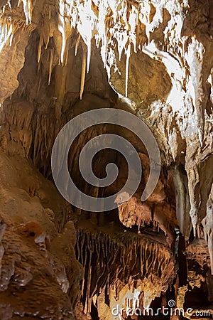 A beautiful Resava cave (Resavska pecina) in Serbia, massive columns of stalagmites and stalactites on the cave bottom. Stock Photo