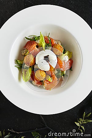 Beautiful Restaurant Plate of Trout Fillet 48 Degrees and Egg Poached with Warm Potatoes Top View Stock Photo