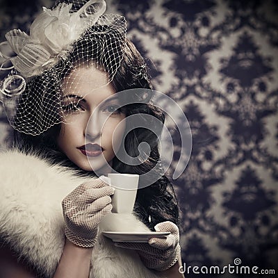 Beautiful retro lady drinking coffee Stock Photo