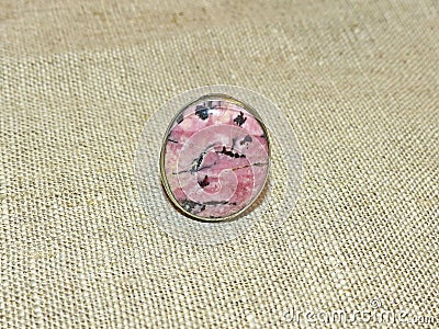 Beautiful rhodonite ring. Rhodonite Greek. rose. Color-pink, cherry-pink or crimson. Stock Photo