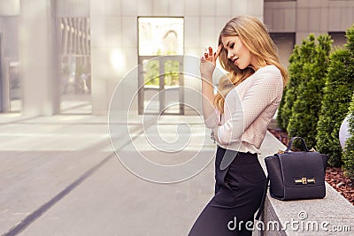 Beautiful rich casual blonde stylish fashion business woman with Stock Photo