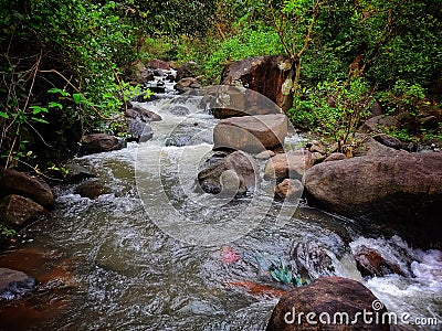 Beautiful river stream running through rocks in asian rain forest full hd Stock Photo