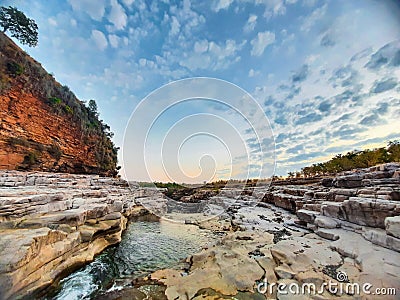 A beautiful river surrounded by rocky mountain at Chidiya Bhadak, Indore, Madhya Pradesh, India Stock Photo