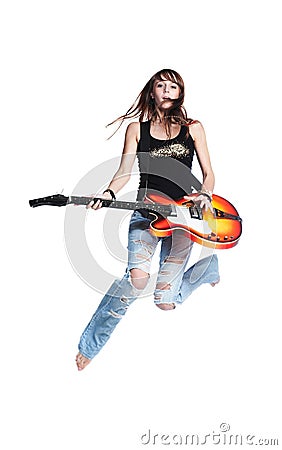 Beautiful rock-n-roll girl jump with guitar Stock Photo