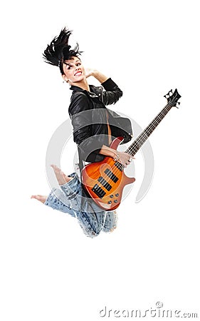 Beautiful rock-n-roll girl jumping with guitar Stock Photo