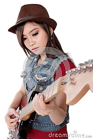 Beautiful rocker girl playing her electric guitar, on white back Stock Photo