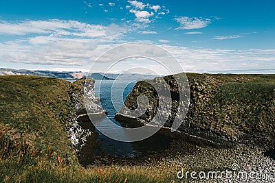 beautiful rocky coast and cold blue water in gatklettur, Stock Photo