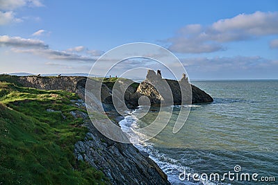 Beautiful rocky seascape and Black Castle ruins along Wicklow coastal line South Quay Corporation Lands Co. Wicklow Ireland Stock Photo