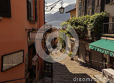 Beautiful rocky sunny alley with historic buildings in Bellagio near Lake Como Editorial Stock Photo