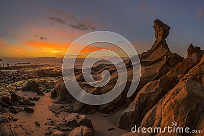 Beautiful rocky Tindakon beach sunset view in Kudat Malaysia Stock Photo