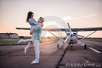 Couple and aircraft Stock Photo