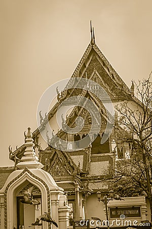 Beautiful roof gable and entrance gate of Wat Suthat temple, Thailand. Wat Suthat Thepphawararam is a royal temple of the first g Stock Photo