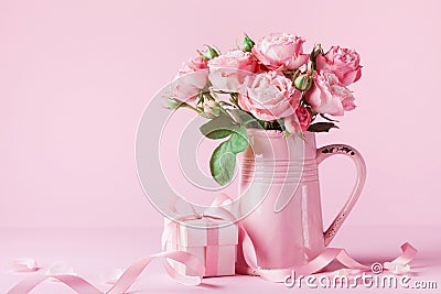 Beautiful rose flowers in pink vase and gift box for Womens day or Mothers day greeting card Stock Photo