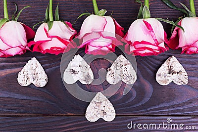 Beautiful roses, wooden hearts Stock Photo