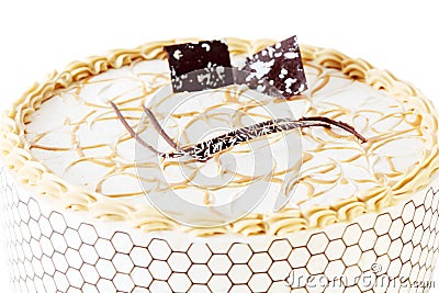 Beautiful round cake with cream and chocolate decorations Stock Photo