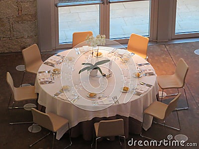 Beautiful round table ready to receive guests and get to eat Stock Photo