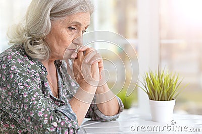 Beautiful sad elderly woman Stock Photo