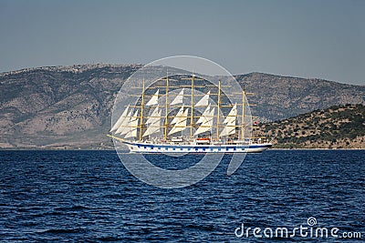 Beautiful sailing ship in the sea on a background of mountains Stock Photo