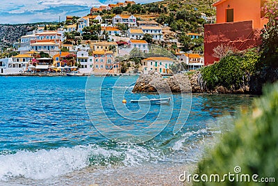 Beautiful sailing yacht near picturesque seacoast. Assos village Mediterranean Sea, Greece. Summer vacation on Greek Stock Photo