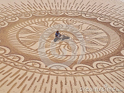 Beautiful sand mandala with its artist named Vitor Raposo Editorial Stock Photo