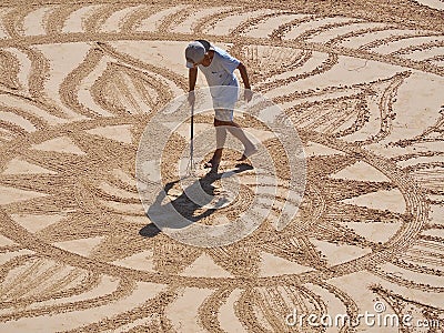 Beautiful sand mandala with its artist named Vitor Raposo Editorial Stock Photo