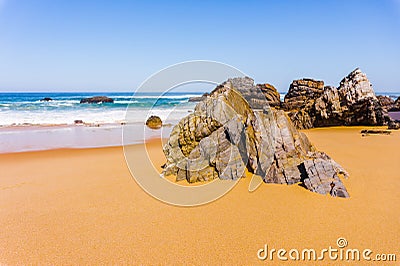 Beautiful sandy beach with rocks on Atlantic coast, Portugal Stock Photo