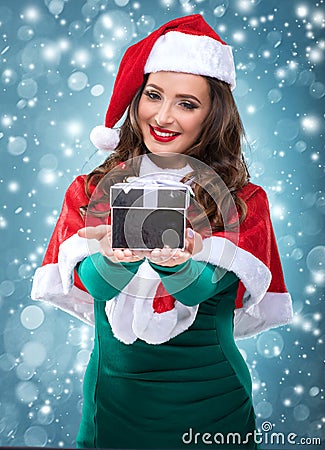 Beautiful santa Woman holding a gift box Stock Photo