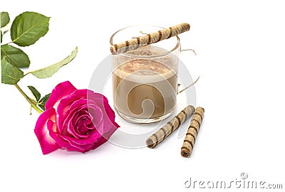 Beautiful scarlet rose and cappuccino with tubular cookies Stock Photo