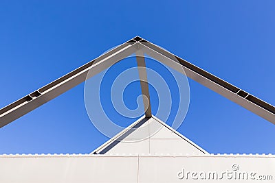 Beautiful scene of Triangular roof frame against Clear blue sky background in town Stock Photo