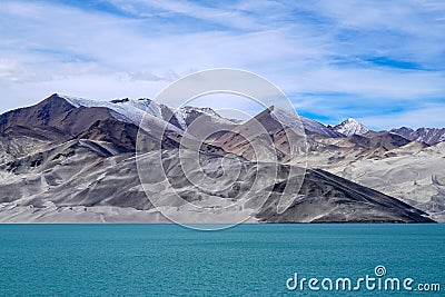 Blue lake, snow mountain, white clouds, blue sky Stock Photo