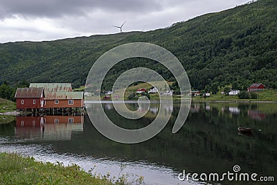 Beautiful scenery of red houses on a stilt house on the Sorfjorden Stock Photo