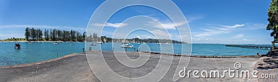 Beautiful scenic bay panorama filled with summer visitors and boats on Motuihe Island Editorial Stock Photo