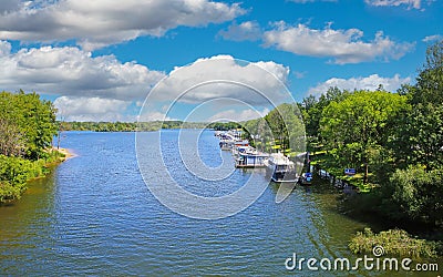 Beautiful scenic dutch lake, yacht harbour, green forest, blue summer sky - Leukermeer, Netherlands Stock Photo