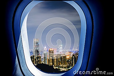 Beautiful scenic night city view through the aircraft window Stock Photo