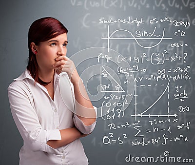 Beautiful school girl thinking about complex mathematical signs Stock Photo