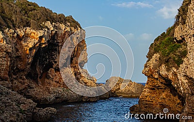 The cliffs of Cala Rafalet in Menorca Stock Photo