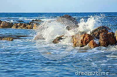 Beautiful sea wave background with rocky shore and foam. Contrast portrait Stock Photo