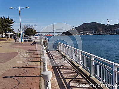 The beautiful seafront of Yeosu city and big arch bridge on the background Editorial Stock Photo