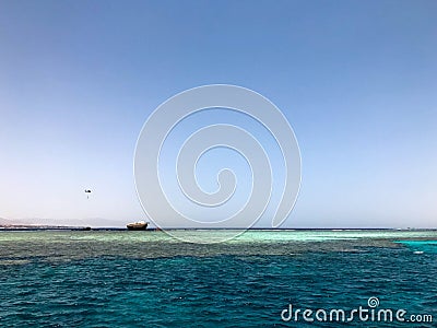 A beautiful seascape overlooking the blue salt sea on the tropical seaside resort and the wreck site of a ship, a boat, a tanker a Stock Photo