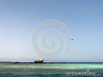 A beautiful seascape overlooking the blue salt sea on the tropical seaside resort and the wreck site of a ship, a boat, a tanker a Stock Photo