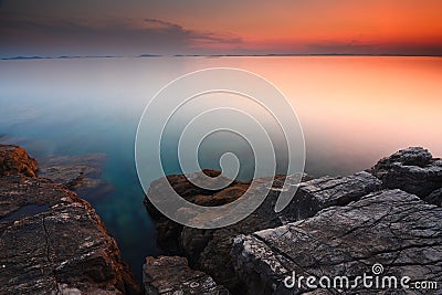 Beautiful seascape. Sea and rock at the sunset Stock Photo