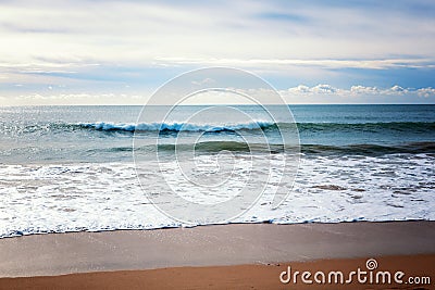 Beautiful seascape, wave rolling on a sandy beach, tropics, vacation, travel background Stock Photo