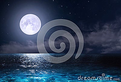 Stars, new moon over the sea at night Stock Photo