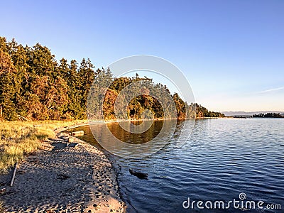 A beautiful secluded sandy beach on Sidney Island in the Gulf Islands of British Columbia, Canada. Stock Photo