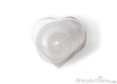 Beautiful selenite heart mineral on white background Stock Photo