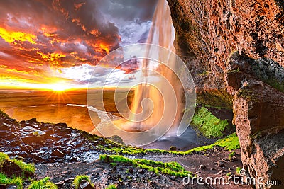 Beautiful Seljalandsfoss waterfall in Iceland during the sunset Stock Photo