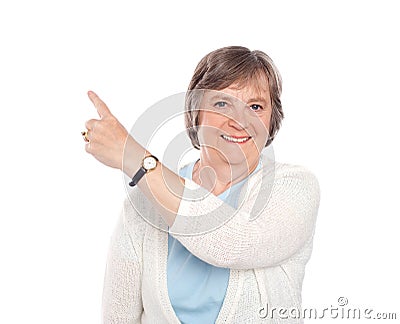 Beautiful senior woman indicating copy space Stock Photo